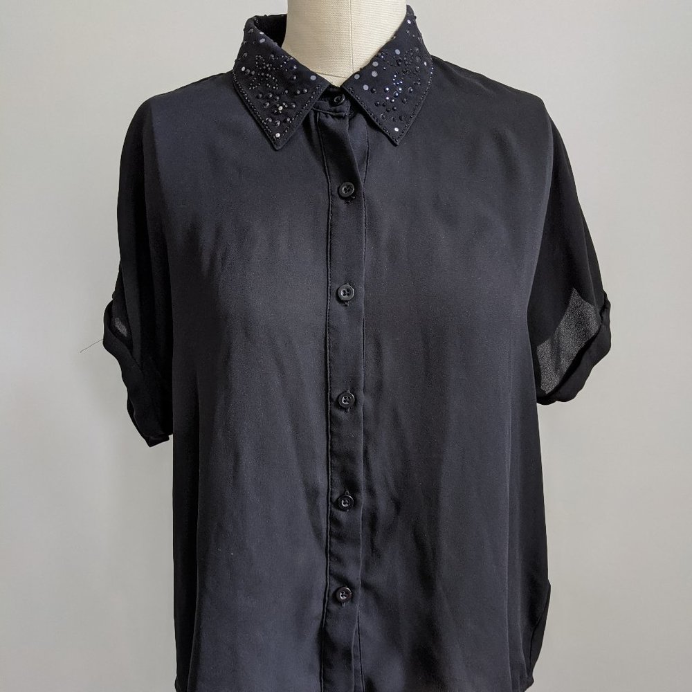 Sheer black open-back blouse with beaded collar